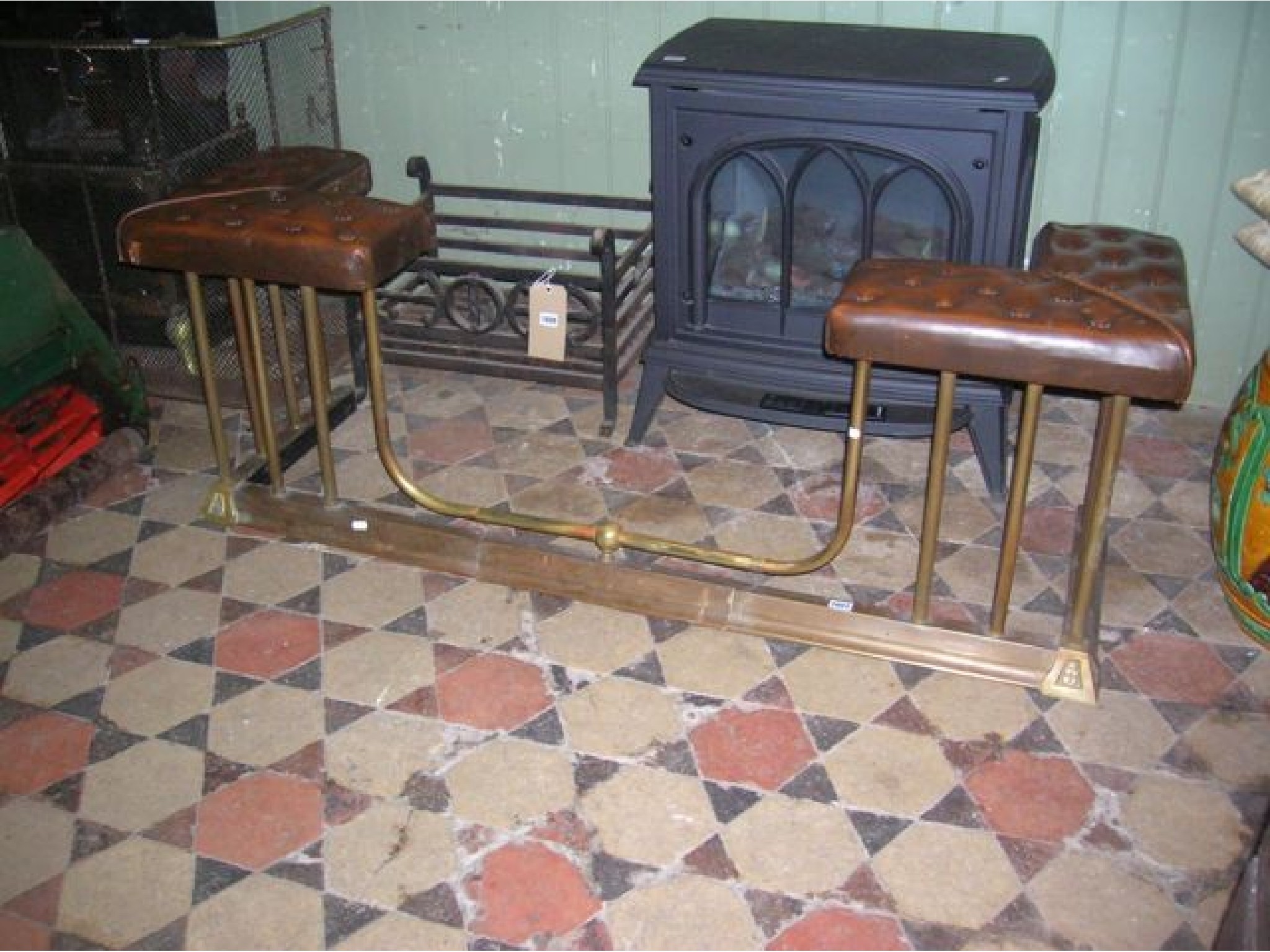 Appraisal: A reproduction brass club fender with turned vertical rails moulded