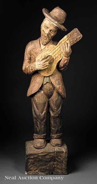 Appraisal: A Continental Carved and Polychromed Wood Statue of a Man