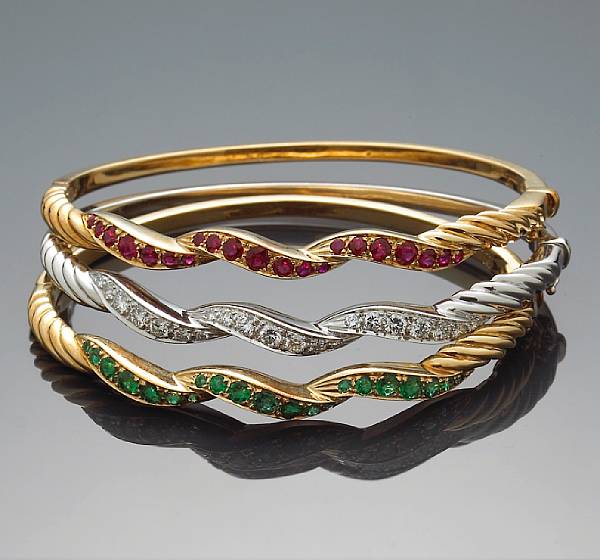 Appraisal: A set of three gem-set and diamond bangles estimated total