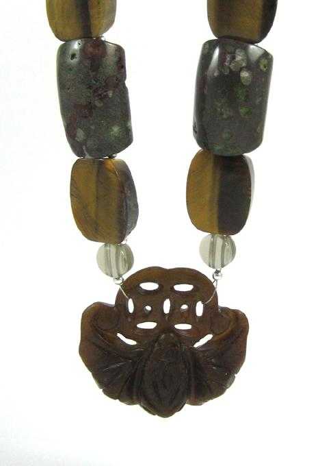 Appraisal: JADE FOSSILIZED CORAL AND TIGER'S EYE NECKLACE measuring inches in