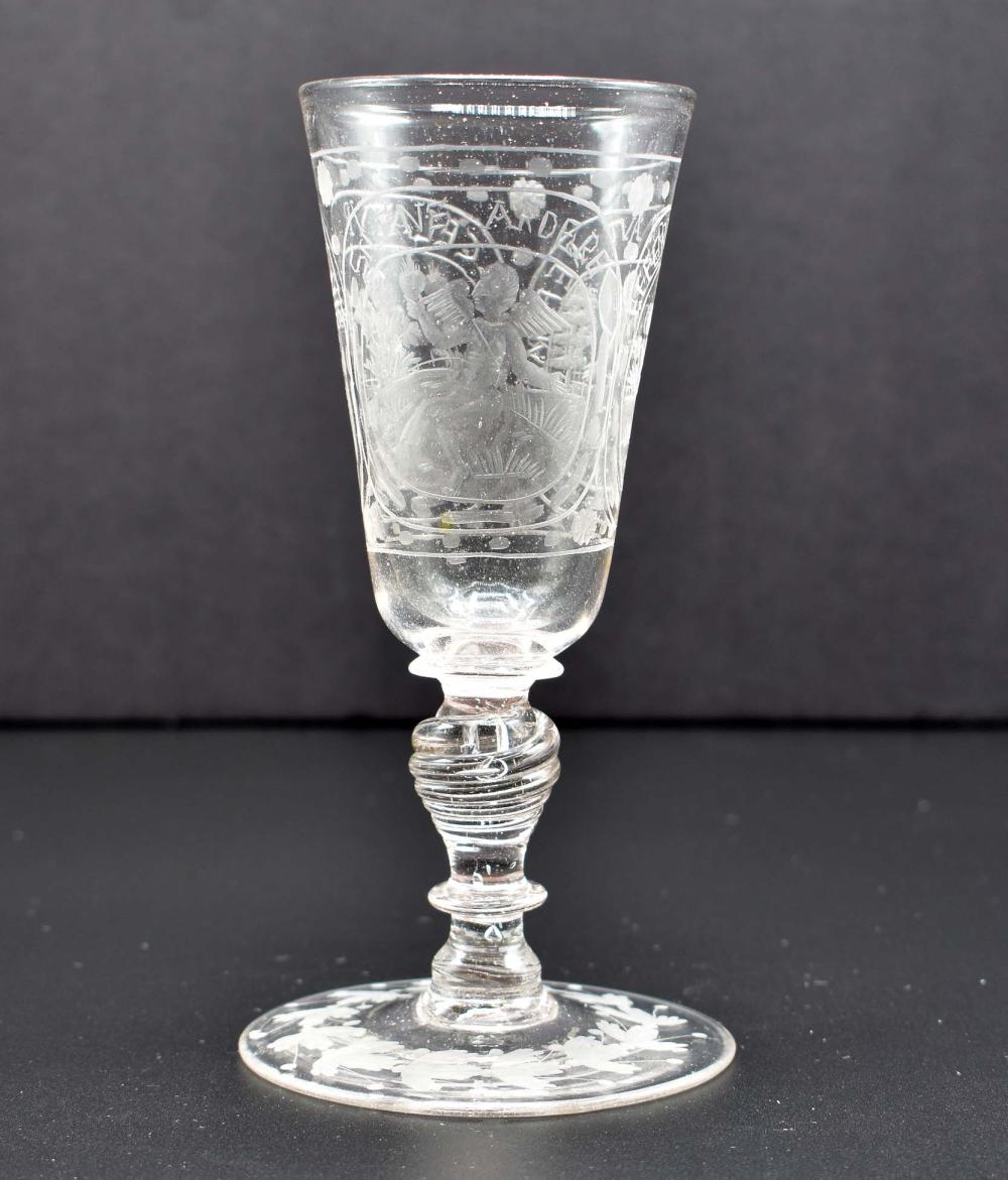 Appraisal: BOHEMIAN ENGRAVED COLORLESS GLASS WINE VESSEL th Century The tapered