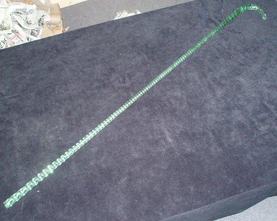 Appraisal: A Victorian twisted green glass cane cm long