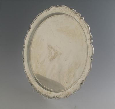 Appraisal: A modern salver with a moulded shaped circular border marks