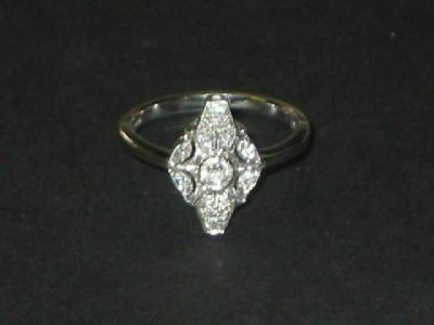 Appraisal: AN EDWARDIAN STYLE DIAMOND RING the pierced top centrally set