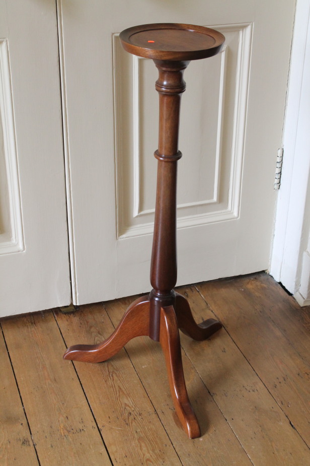 Appraisal: A mahogany torchere in the Georgian manner