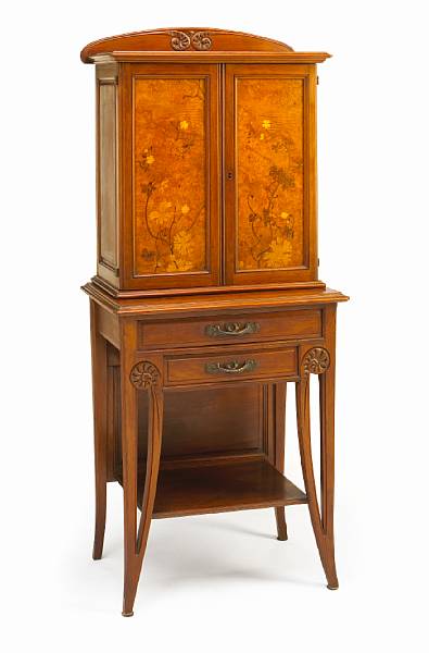 Appraisal: A Majorelle marquetry inlaid two-part cabinet early th century signed