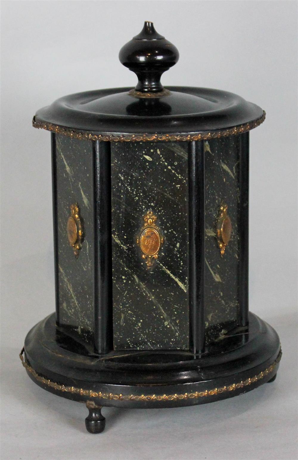 Appraisal: BLACK LACQUER CIGAR CADDY WITH REVOLVING DOORS remnants of paper