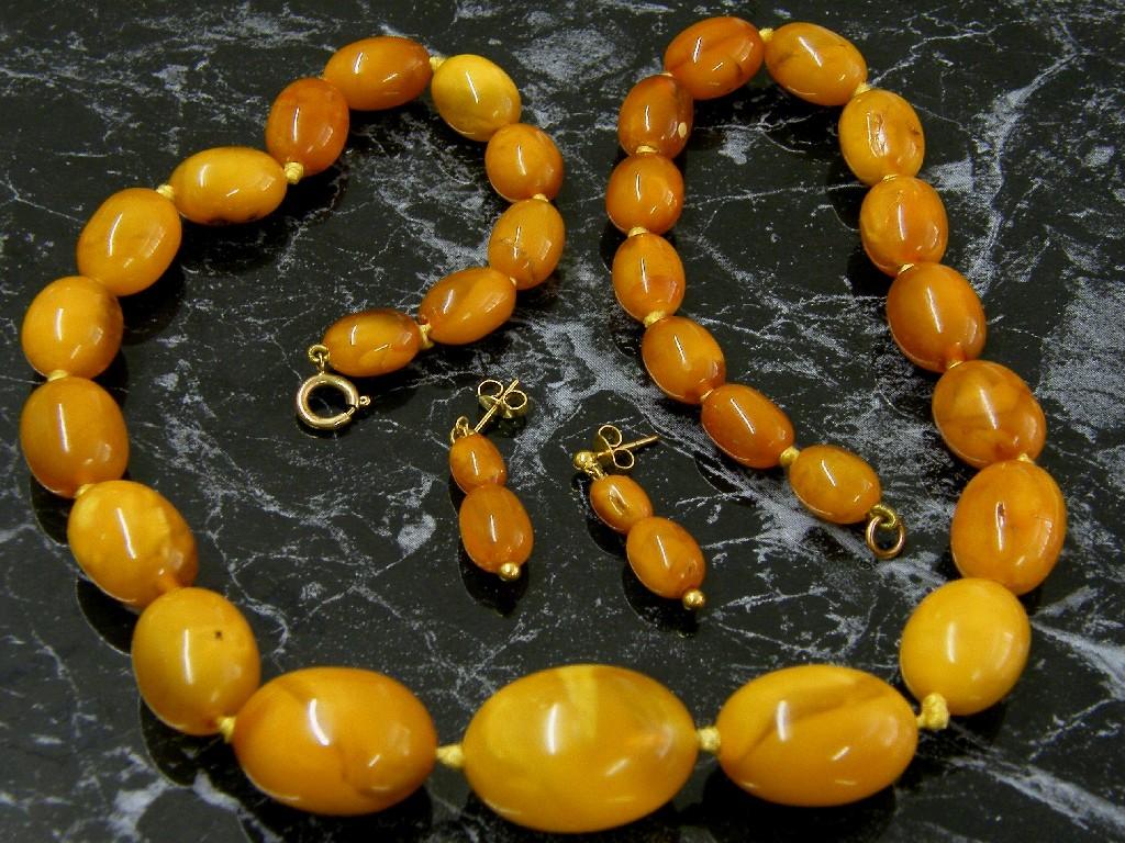 Appraisal: Graduated amber bead necklet long together with a pair of