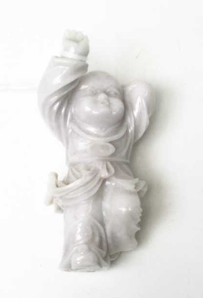 Appraisal: CHINESE CARVED LAVENDER JADE FIGURAL SCULPTURE depicting a young boy