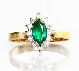 Appraisal: An ct gold emerald and twelve diamond cluster ring size