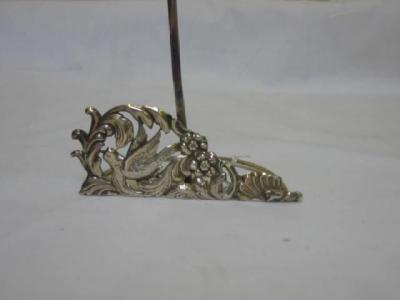 Appraisal: A VICTORIAN MENU HOLDER the pierced and embossed front depicting