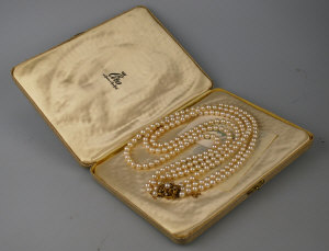 Appraisal: Three-row cultured pearl necklace on large s cluster style trunk