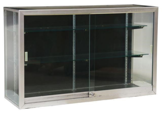 Appraisal: Display case th c having silver-tone metal frame encasing glass