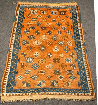 Appraisal: A Moroccan rug modern copper red gul field ft in