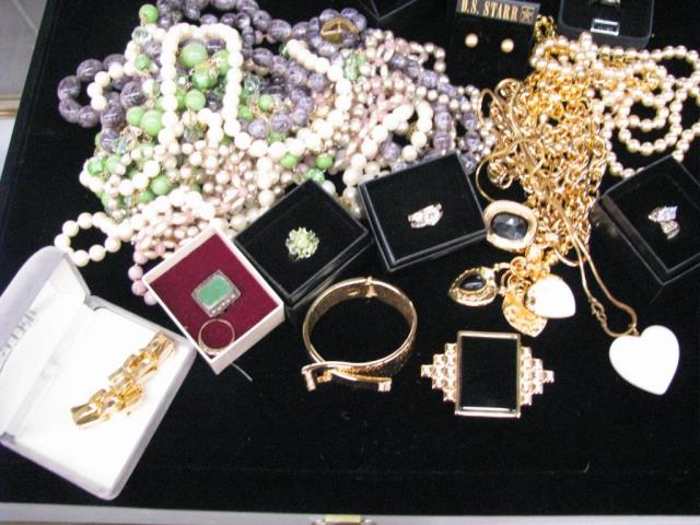 Appraisal: A large group of costume jewelry including necklaces pins brooches