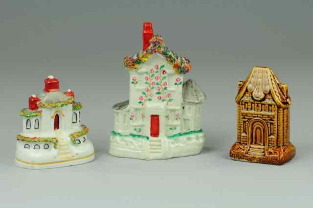 Appraisal: LOT OF THREE CERAMIC STILL BANKS Includes two Staffordshire houses