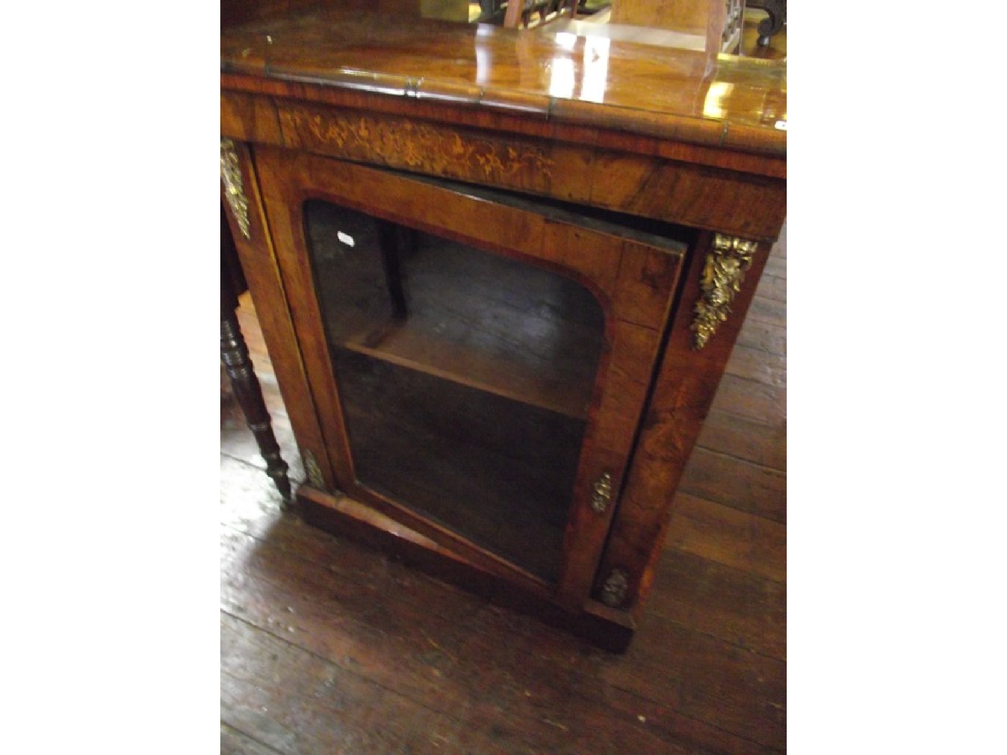 Appraisal: A Victorian walnut and figured walnut Pier cabinet glazed panel