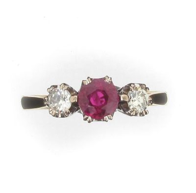 Appraisal: A ruby and diamond three stone ring Set in ct