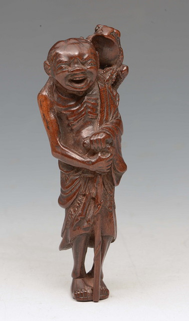 Appraisal: A WOOD NETSUKE of Gama Sennin Edo period th Century