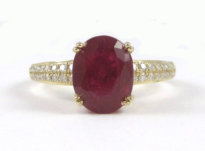 Appraisal: RUBY DIAMOND AND FOURTEEN KARAT GOLD RING with round-cut diamonds