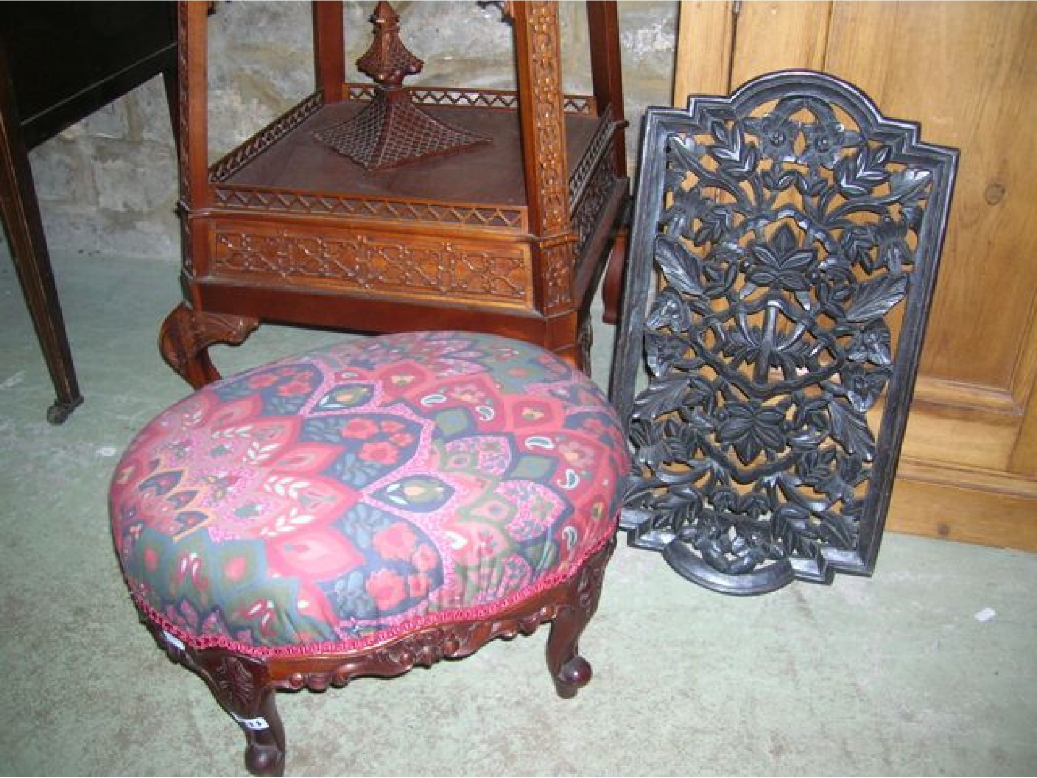 Appraisal: A reproduction mahogany footstool of oval form with upholstered top