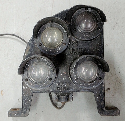 Appraisal: - Cast iron four-light railroad track light U h x