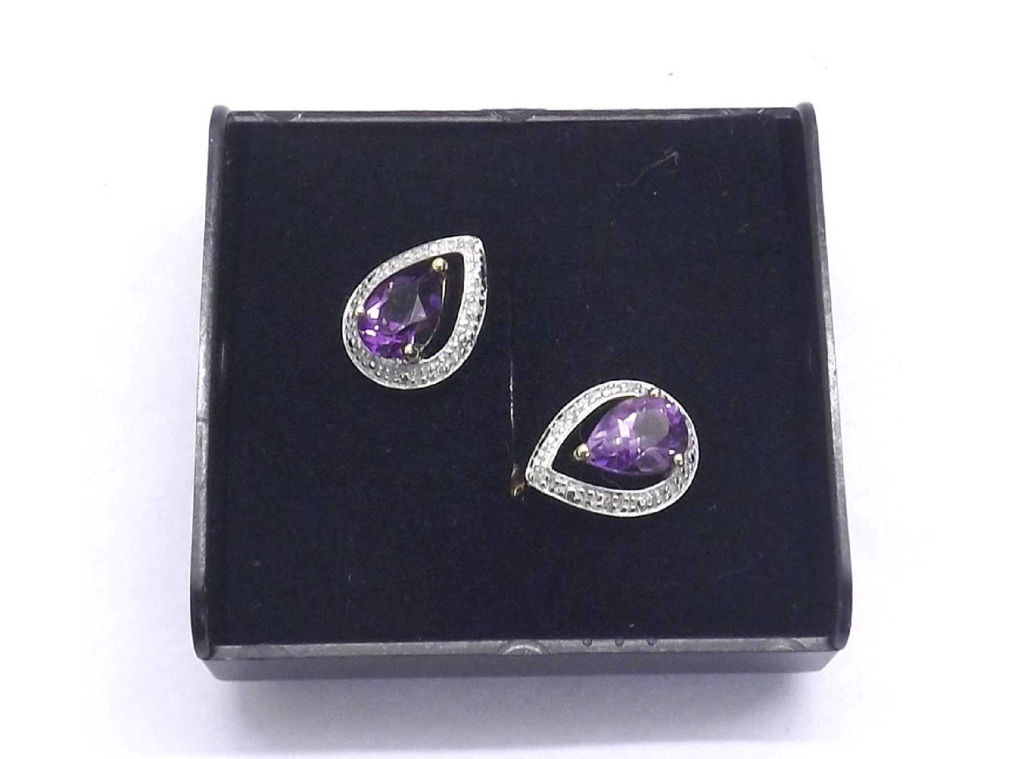 Appraisal: Pair of ct amethyst and diamond pear shaped ear studs