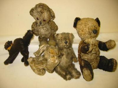 Appraisal: Three various small teddy bears a dog and a black