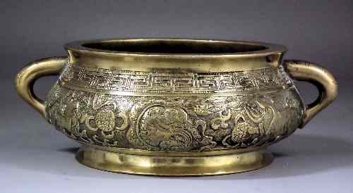 Appraisal: A th Century Chinese bronze circular two-handled censer cast with