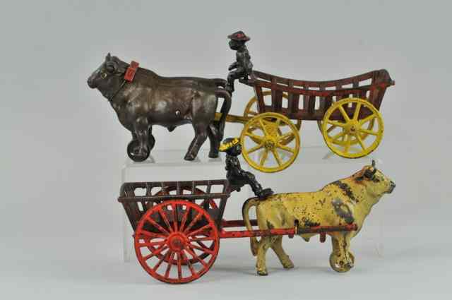 Appraisal: a LOT OF TWO PLANTATION OX CARTS Kenton cast iron