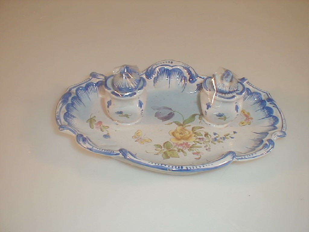 Appraisal: A French Faience ink stand the disk of shell form