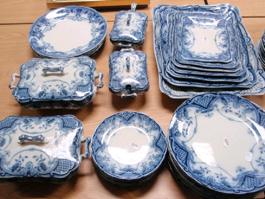 Appraisal: A Bute pattern Staffordshire flow blue dinner service comprising seven