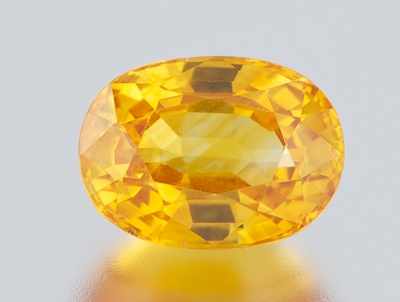 Appraisal: An Unmounted Golden Sapphire Carat Oval faceted cut x mm