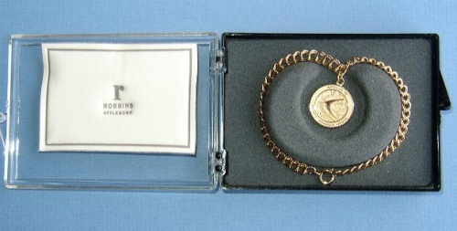 Appraisal: Apollo Charm Bracelet A golden chain and a -inch charm