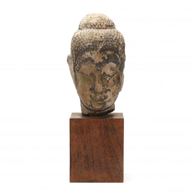 Appraisal: A CARVED STONE THAI BUDDHA HEAD Likely th century the