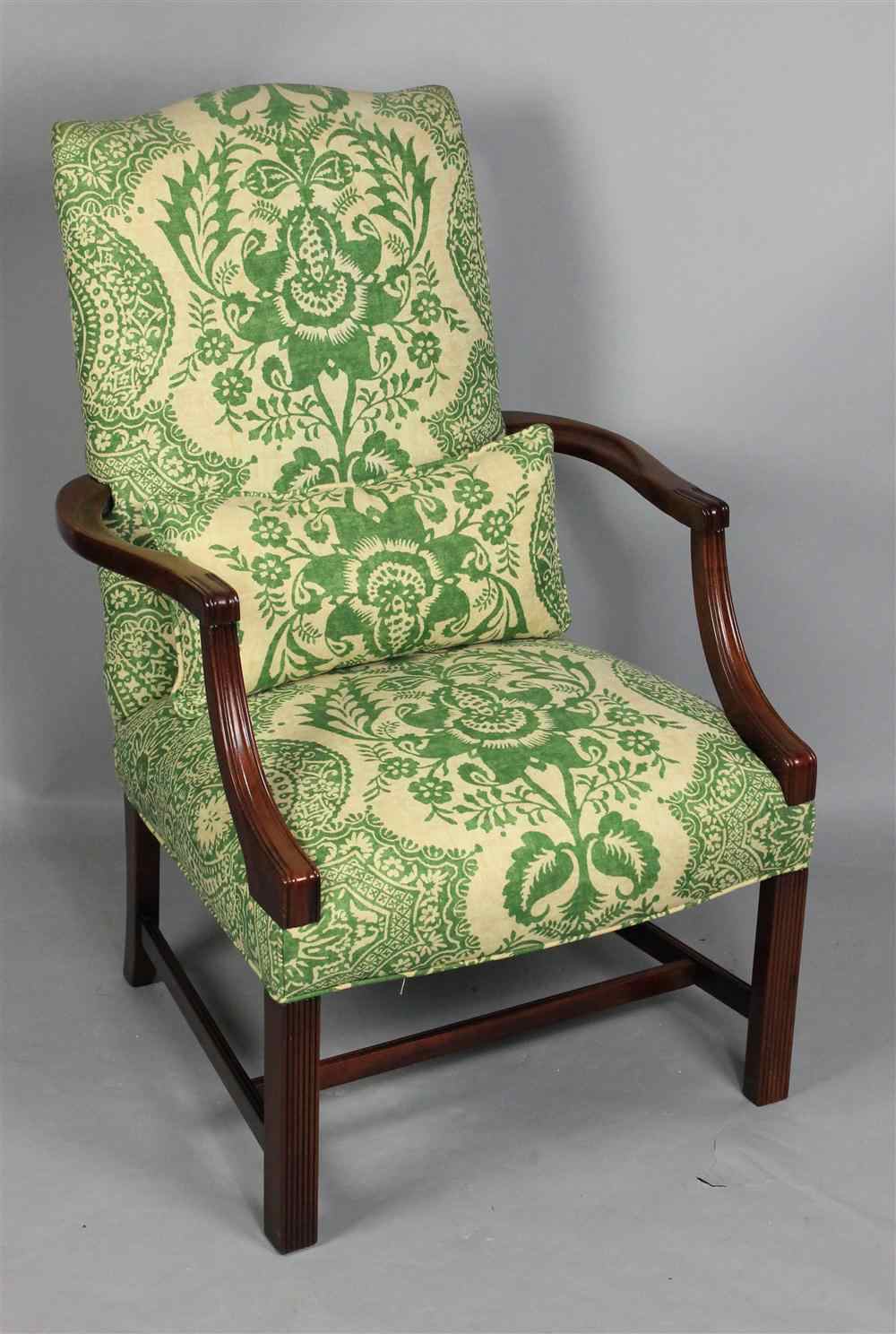 Appraisal: COTTON DAMASK UPHOLSTERED MAHOGANY LOLLING CHAIR tight arched back raised