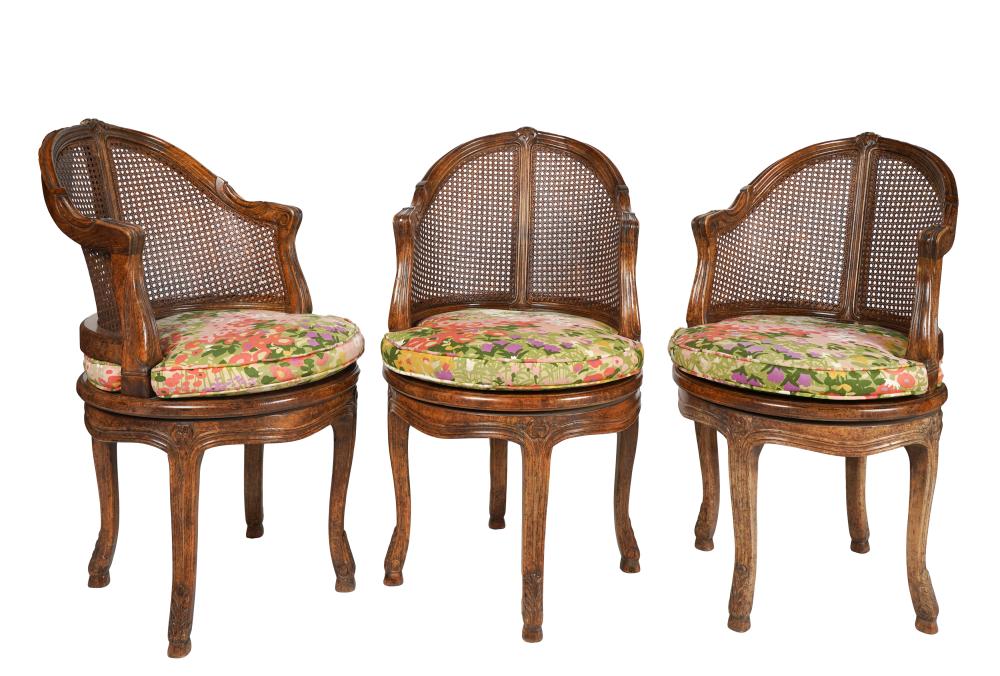 Appraisal: THREE FRENCH PROVINCIAL-STYLE SWIVEL CHAIRS th century unsigned each with