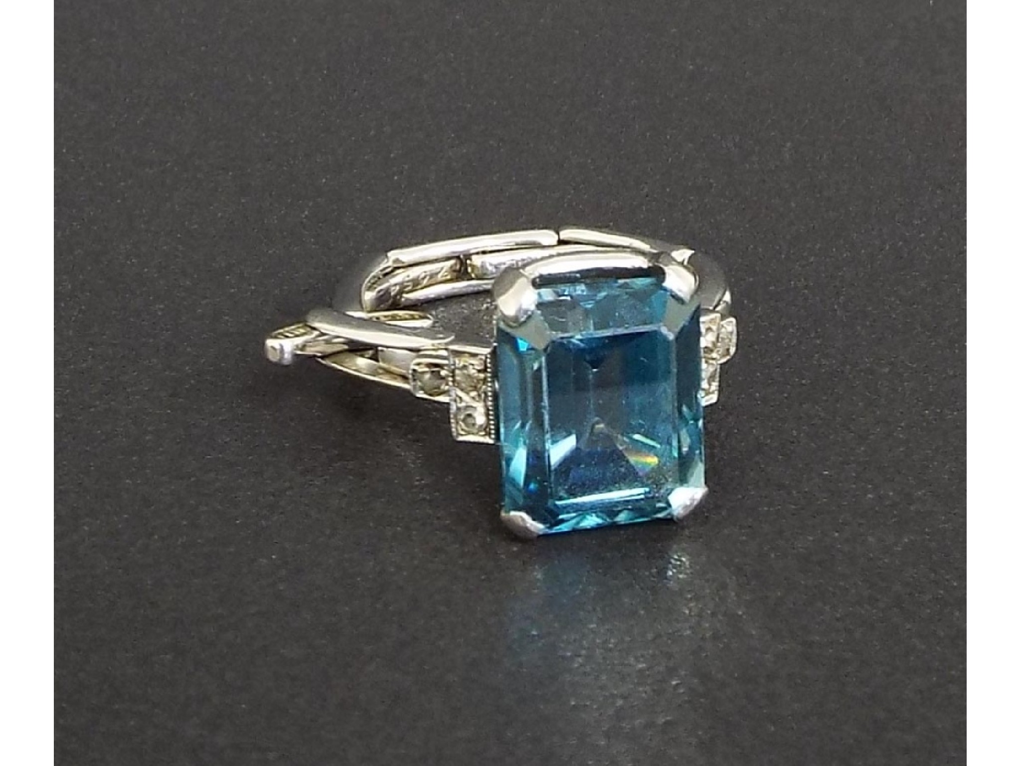 Appraisal: Blue topaz and diamond white gold expanding dress ring stamped