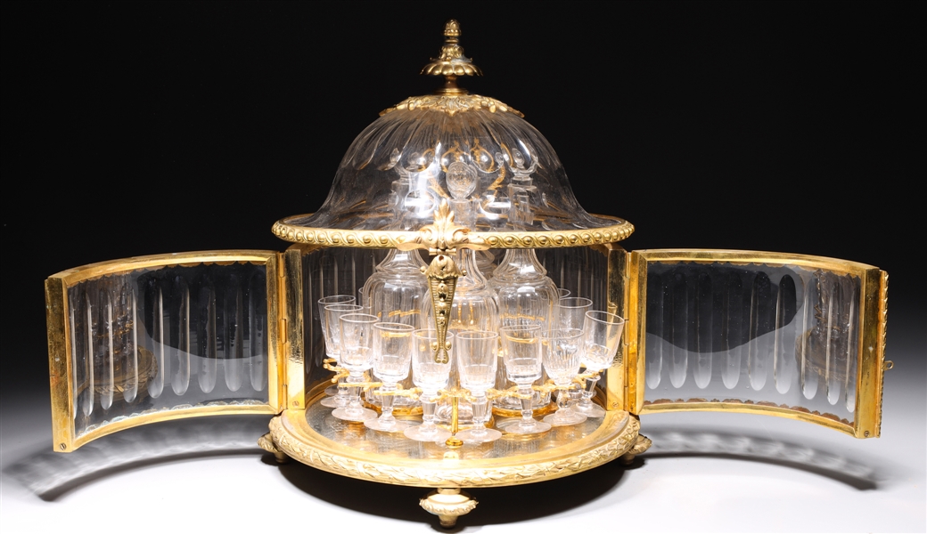 Appraisal: Elaborate gilt and glass liqueur set with four glass decanters