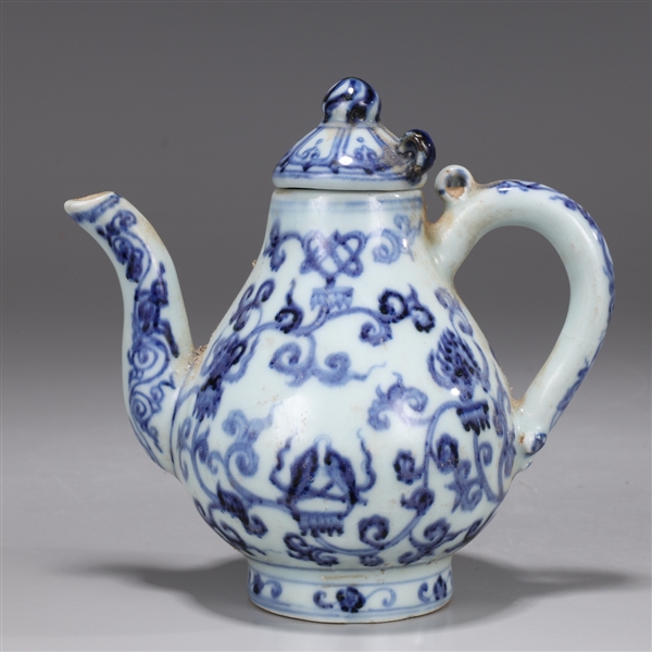 Appraisal: Chinese blue and white covered tea pot with looped to