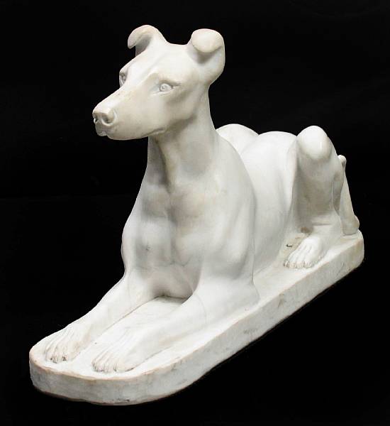 Appraisal: A Carrara marble figure of a recumbent dog height in