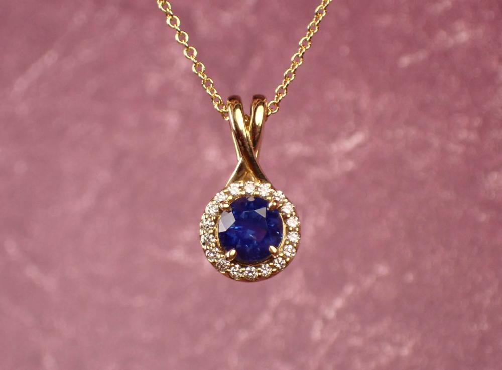 Appraisal: DIAMOND BLUE SAPPHIRE AND FOURTEEN KARAT GOLD PENDANT NECKLACE the