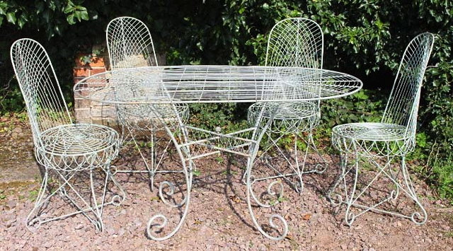 Appraisal: A GREEN PAINTED WIREWORK GARDEN TABLE with rounded ends and