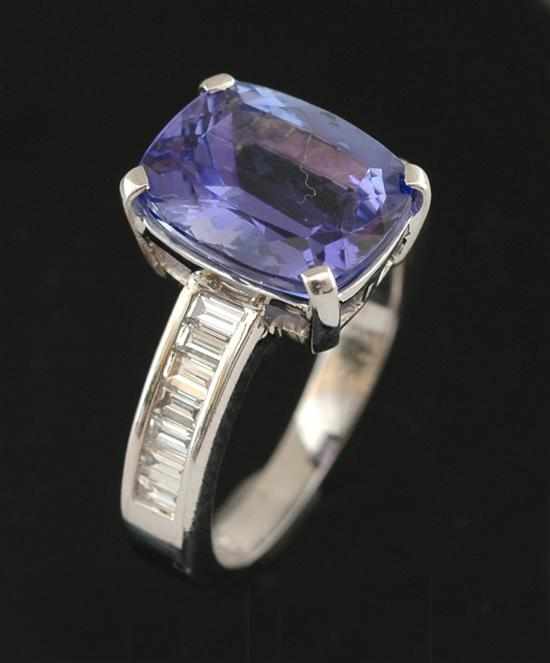 Appraisal: A tanzanite and diamond ring Centrally set with a cushion