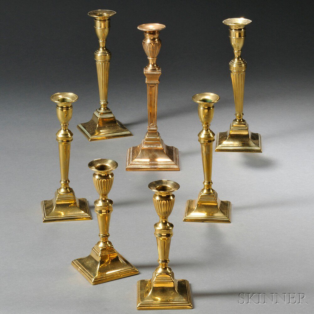 Appraisal: Seven Square-base Brass Candlesticks England late th early th century