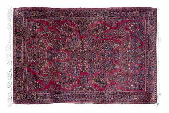 Appraisal: A Sarouk Wool Rug having allover foliate design on a