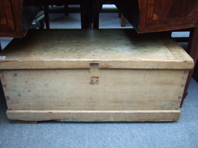 Appraisal: A pine trunk with carry handles and a plinth base