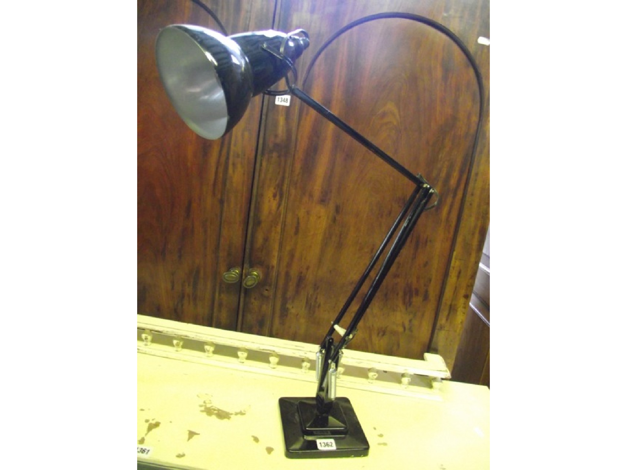 Appraisal: An anglepoise table lamp with square stepped base and black