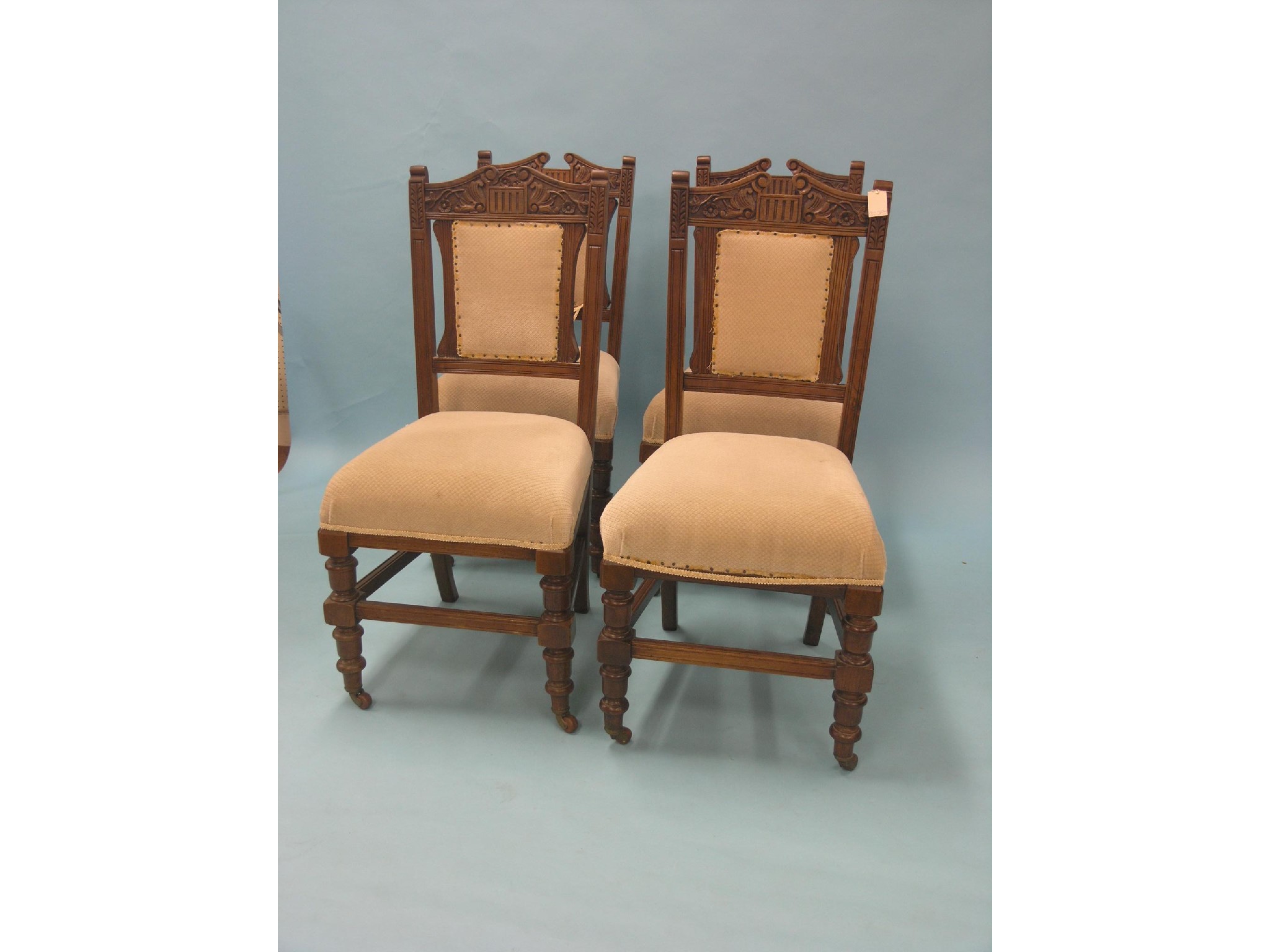 Appraisal: A set of four late Victorian walnut dining chairs carved