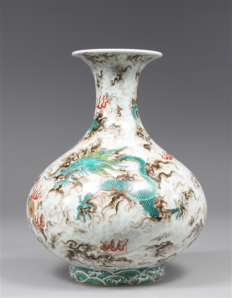 Appraisal: Elaborate Chinese enameled porcelain bottle vase with dragons chasing flaming